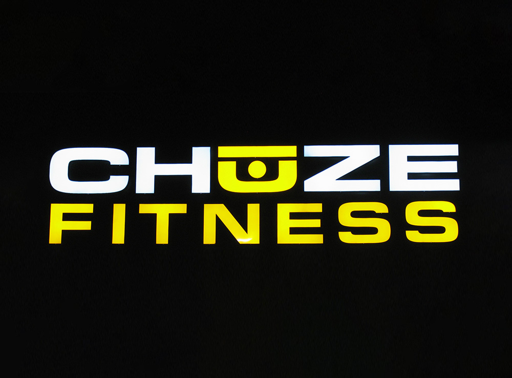 Chuze Fitness front lit channel letters at night